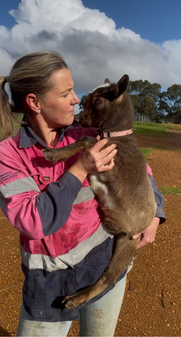 Owner Kylie and her miniature goat Tiny Dancer